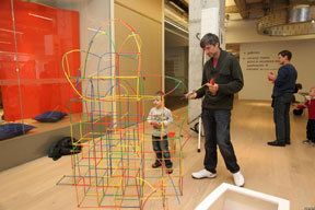 Boy making straws and connector structure with parent