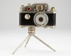 Camera miniature (lighter) with tripod, and portrait